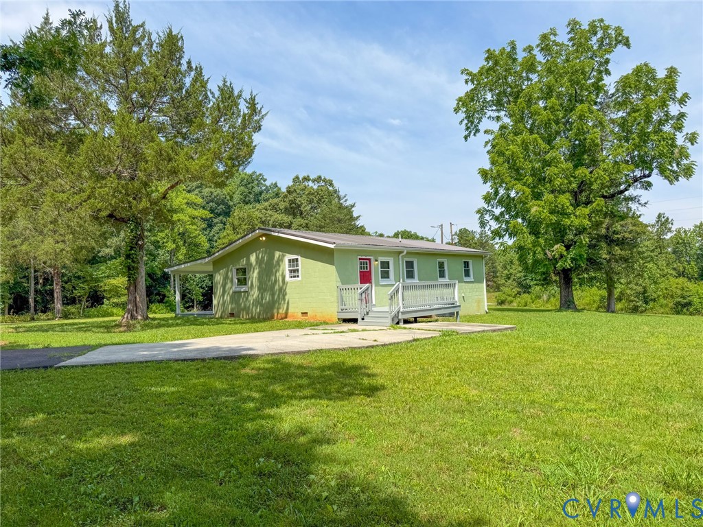 7798 West Courthouse Road Burkeville, VA 23922 - Photo 16 of 23 Green-painted exterior featuring a red entry door,