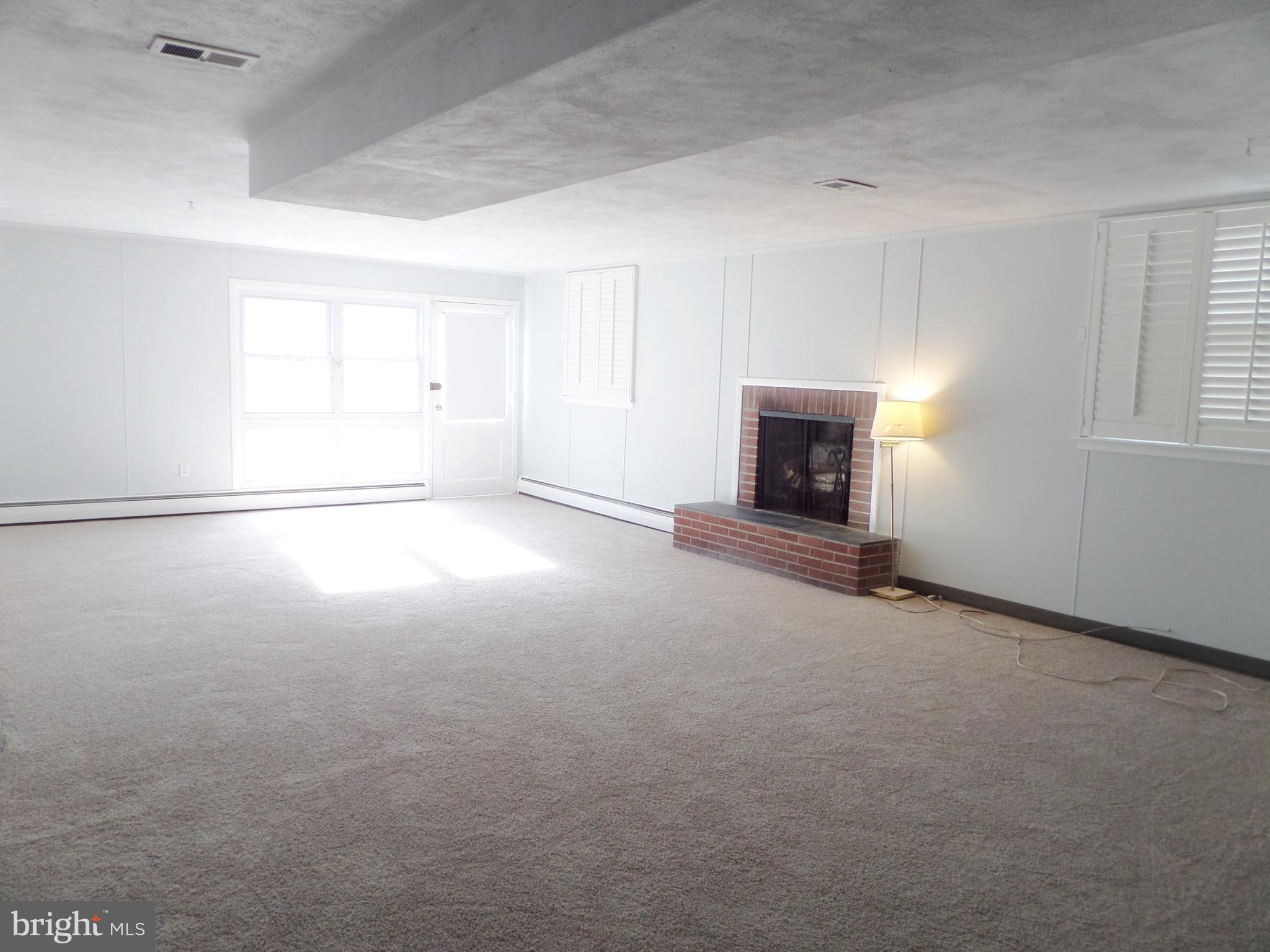 514 Laverock Road Glenside, PA 19038 - Photo 37 of 55 Family Room w/raised hearth Brk wood burning FPL