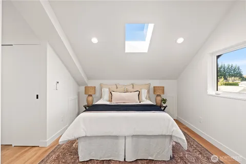 a bed room with a bed and a night stand