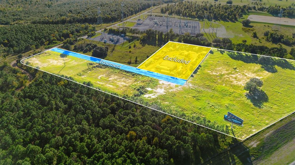 13415 Sullivan Road Minneola, FL 34715 - Photo 2 of 13 a view of a lake and a yard