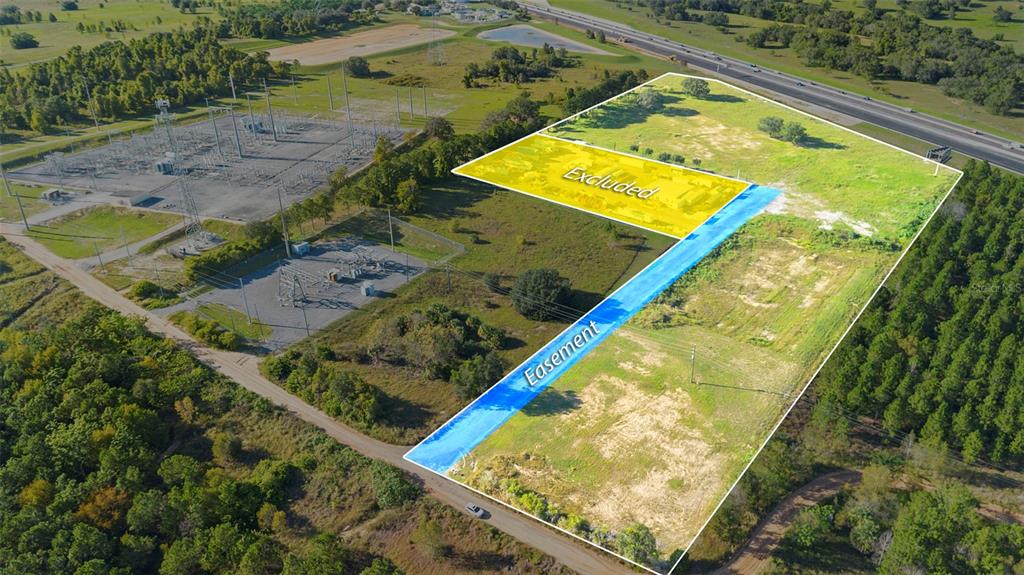 13415 Sullivan Road Minneola, FL 34715 - Photo 3 of 13 a view of a backyard with swimming pool