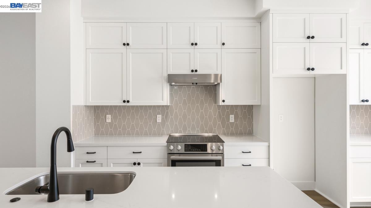 1925 Grand Street Alameda, CA 94501 - Photo 11 of 39 a kitchen with a sink and cabinets