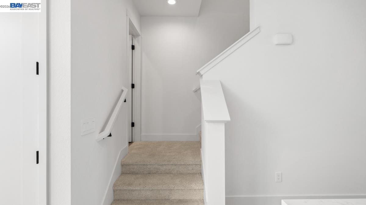 1925 Grand Street Alameda, CA 94501 - Photo 20 of 39 a view of staircase with white walls and white door
