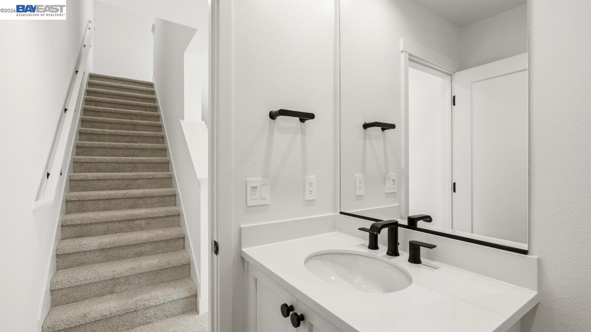1925 Grand Street Alameda, CA 94501 - Photo 21 of 39 a bathroom with a sink and a mirror