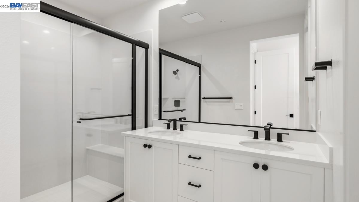 1925 Grand Street Alameda, CA 94501 - Photo 26 of 39 a bathroom with a sink and a mirror