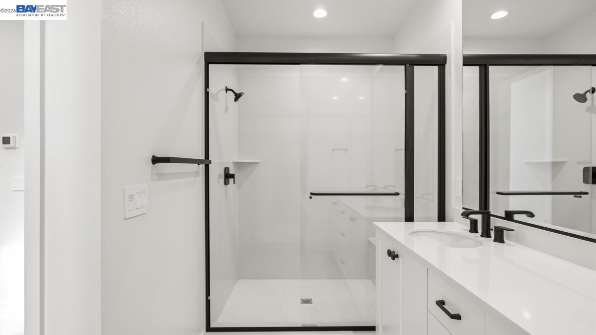 1925 Grand Street Alameda, CA 94501 - Photo 27 of 39 a bathroom with a shower and a sink