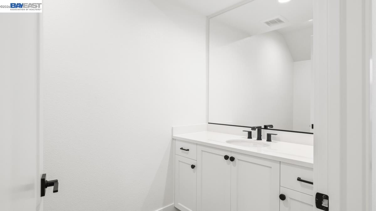 1925 Grand Street Alameda, CA 94501 - Photo 8 of 39 a bathroom with a sink and mirror