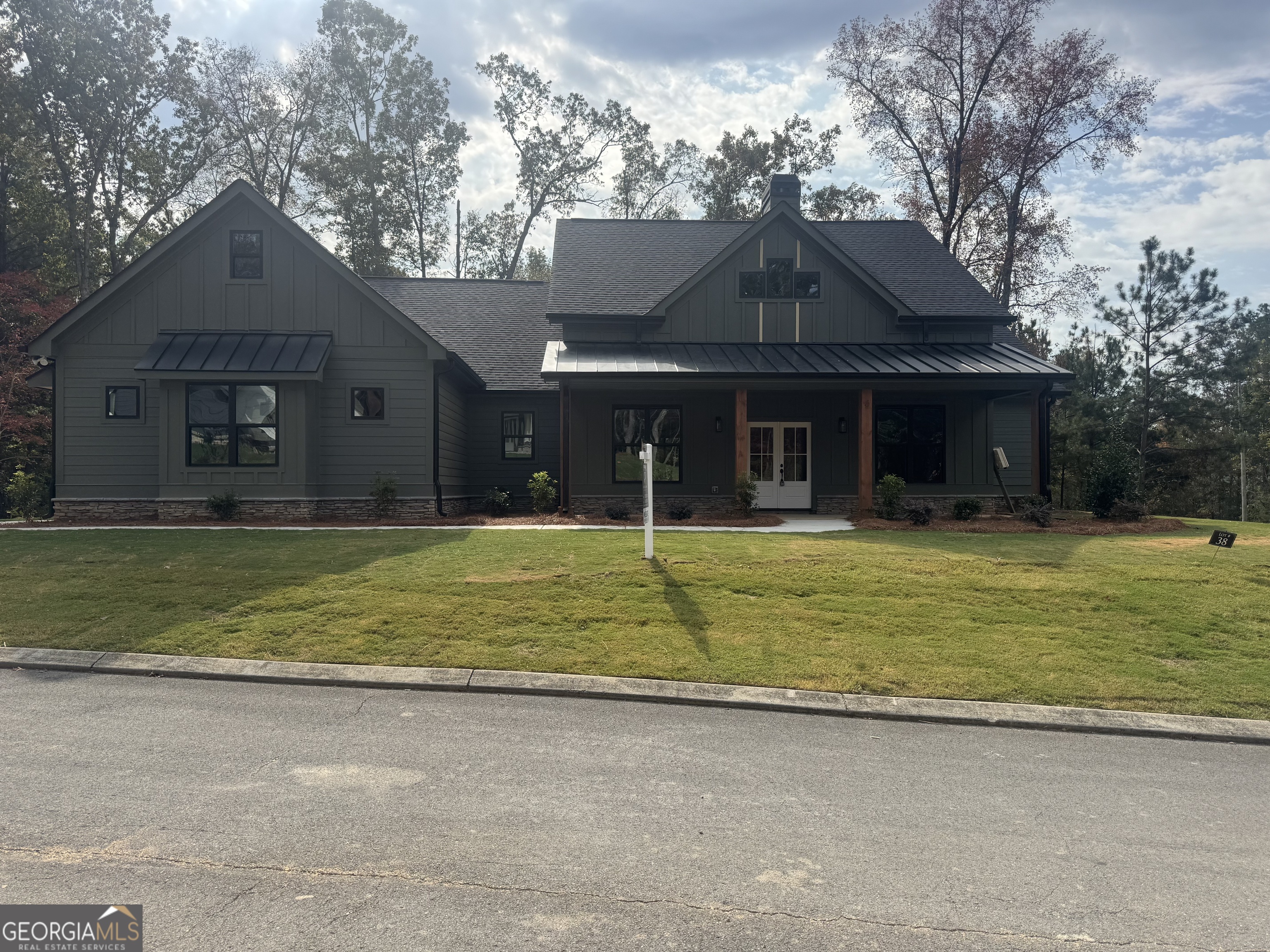 115 Cliffs Drive Dalton, GA 30721 - Photo 1 of 10 a front view of a house with a yard