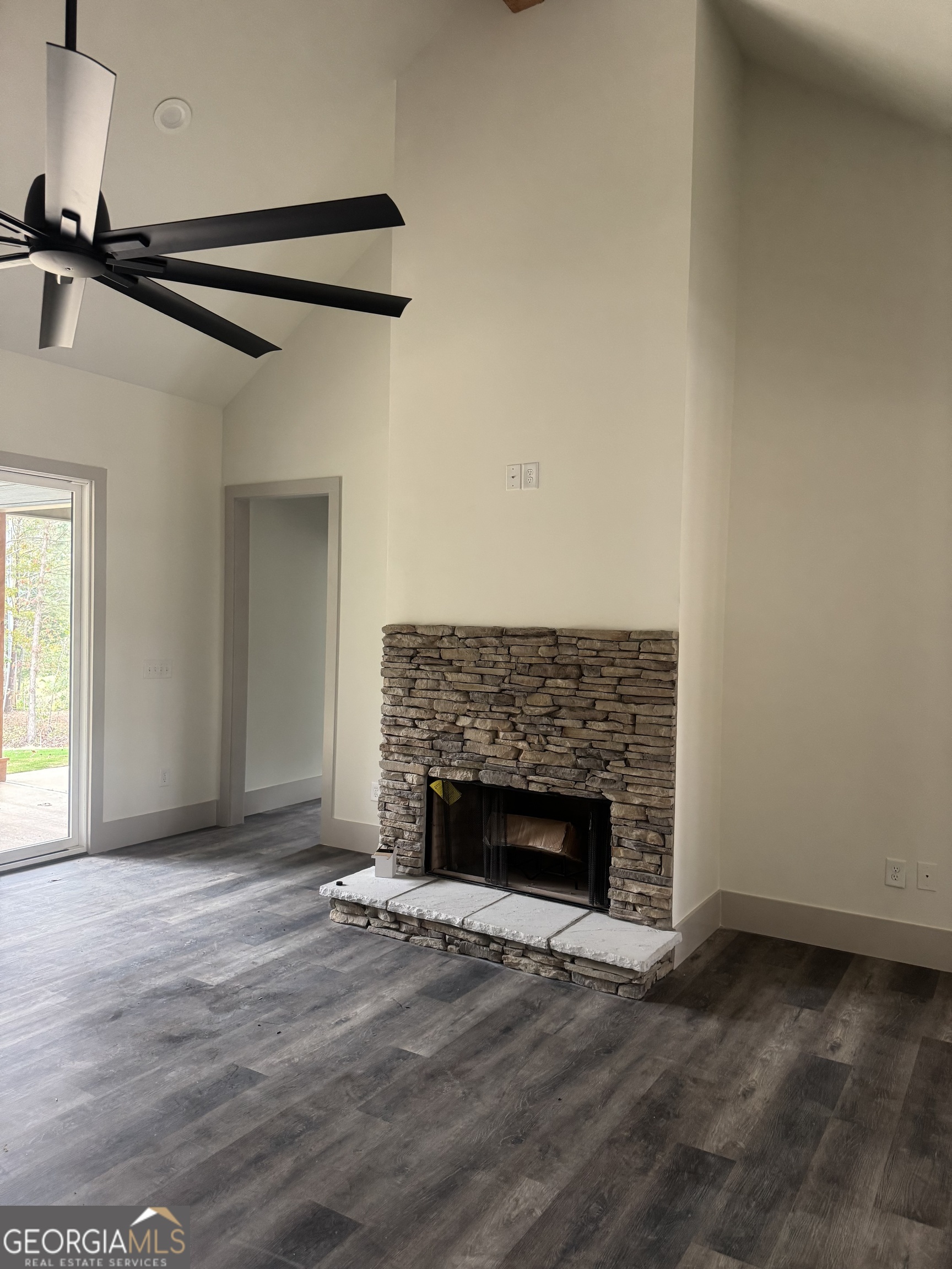 115 Cliffs Drive Dalton, GA 30721 - Photo 5 of 10 a view of empty room with wooden floor and fireplace