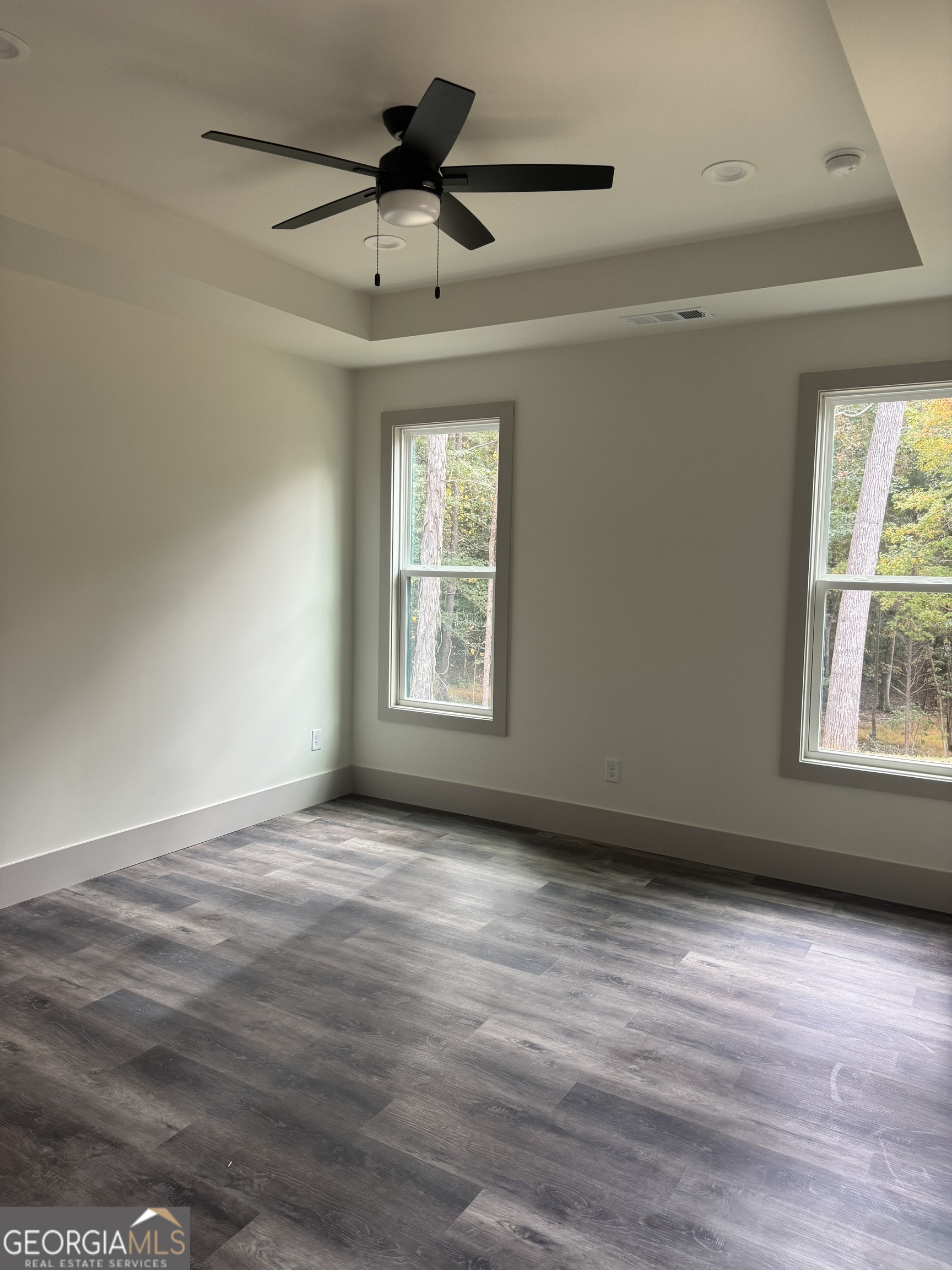 115 Cliffs Drive Dalton, GA 30721 - Photo 7 of 10 a view of an empty room with a window and wooden floor