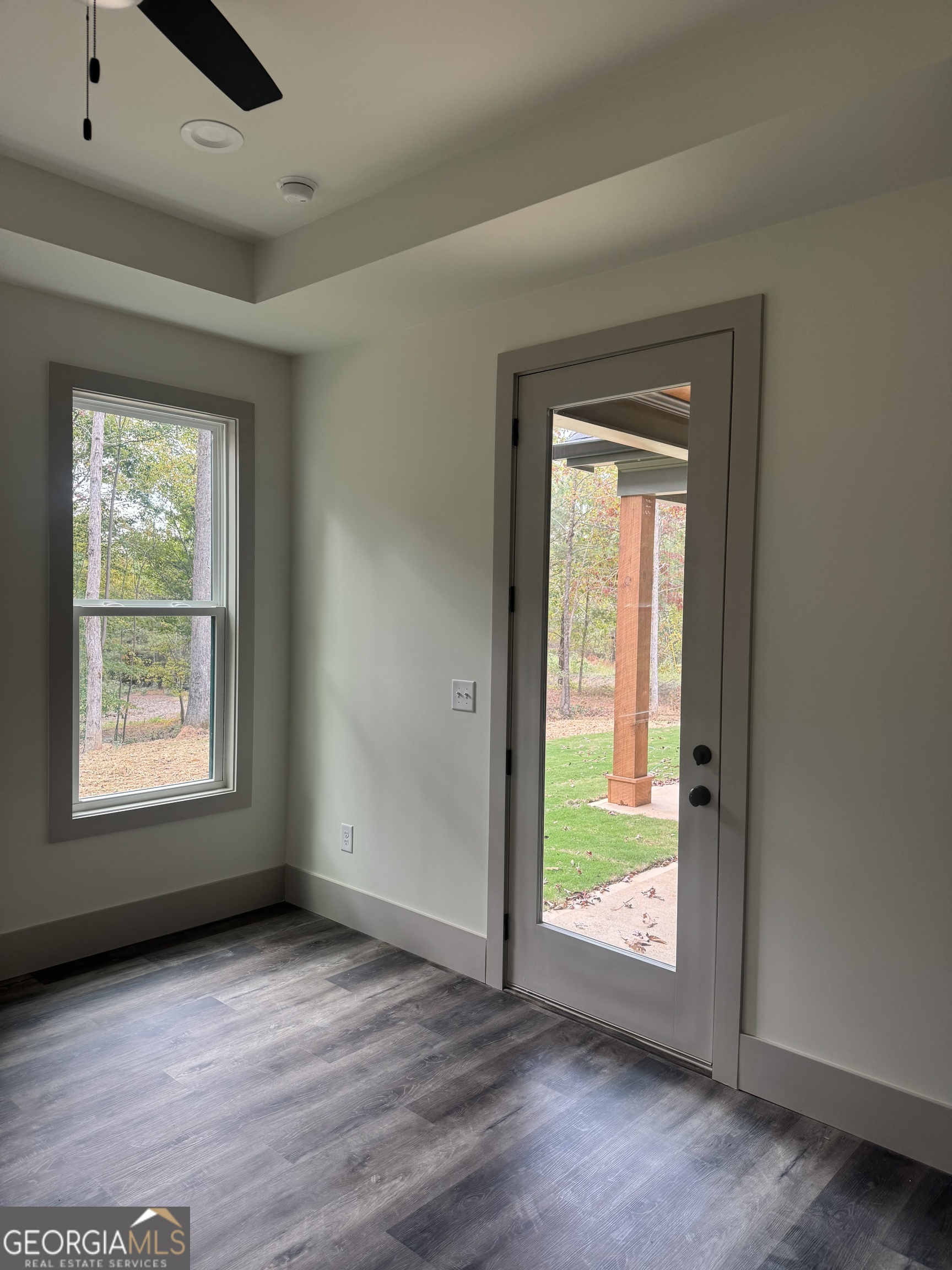 115 Cliffs Drive Dalton, GA 30721 - Photo 8 of 10 an empty room with wooden floor and windows