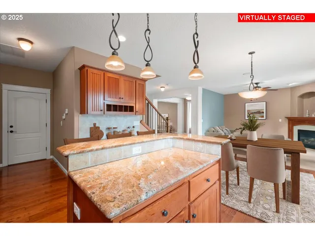 a kitchen with a table and chairs in it