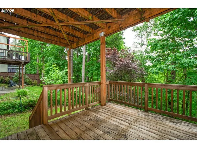 a view of balcony with wooden floor