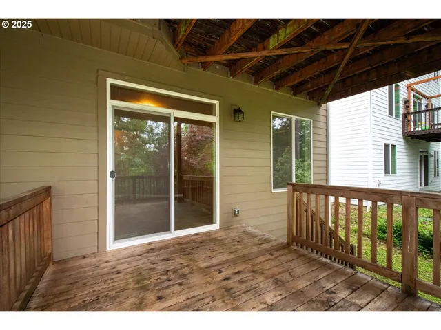 a view of outdoor space with wooden floor