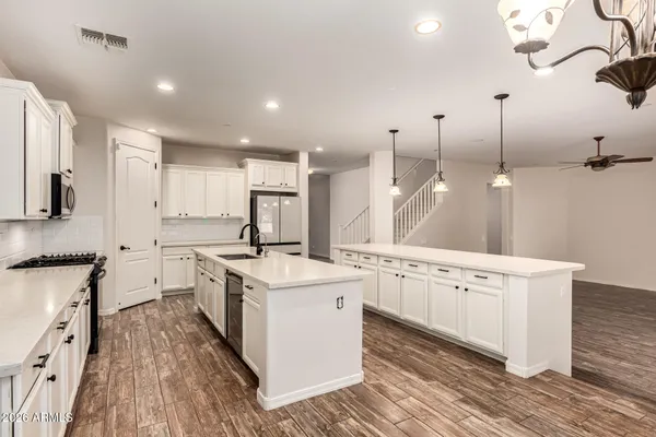 a bathroom with a sink toilet and a mirror