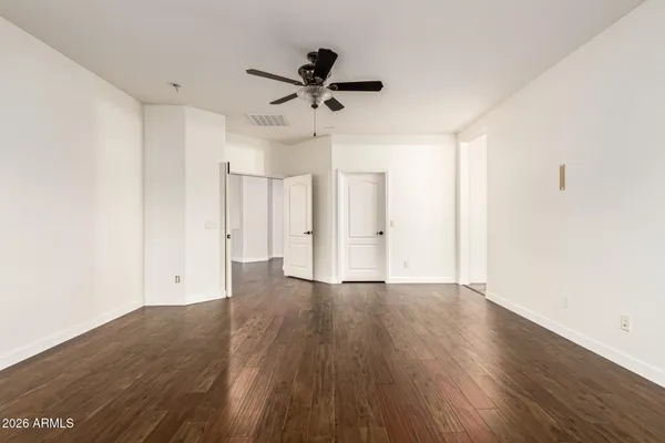 a view of a white house with a yard