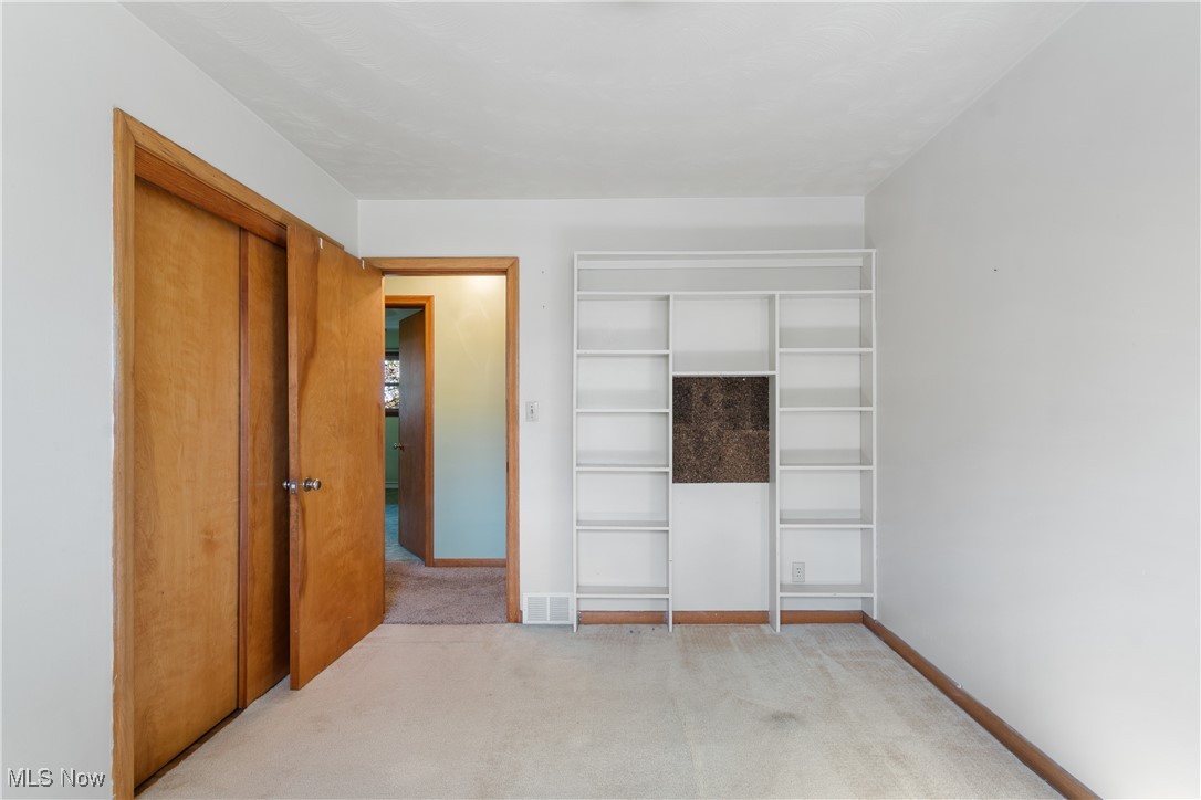 3240 Copley Road Akron, OH 44321 - Photo 24 of 35 Bedroom with a closet and light colored carpet