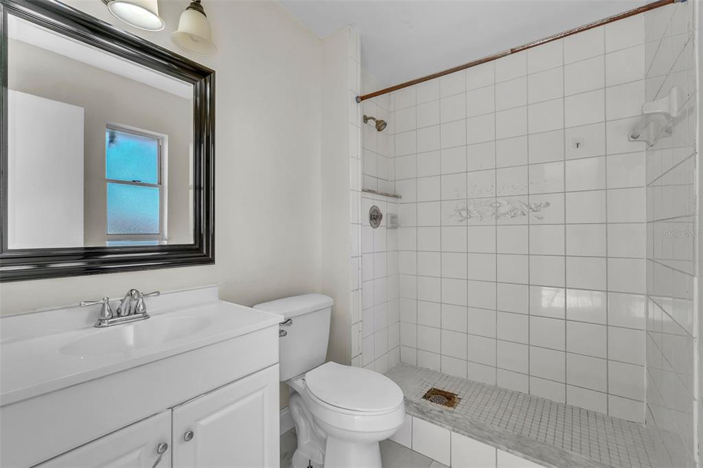 7724 Pengrove Pass Orlando, FL 32835 - Photo 15 of 24 a bathroom with a sink toilet and shower