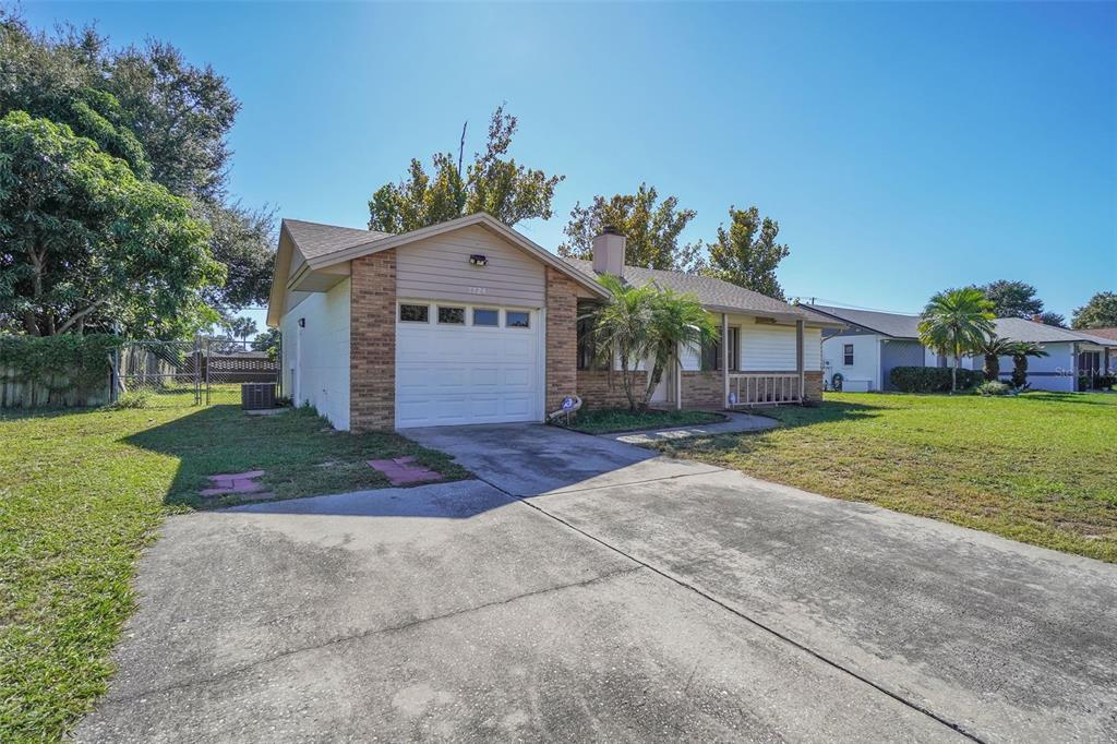 7724 Pengrove Pass Orlando, FL 32835 - Photo 2 of 24 a view of house with outdoor space