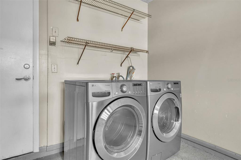 7724 Pengrove Pass Orlando, FL 32835 - Photo 21 of 24 a utility room with dryer and washer