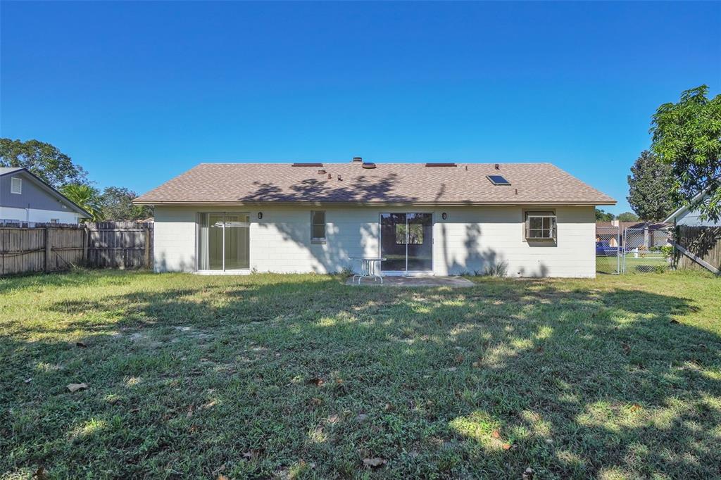 7724 Pengrove Pass Orlando, FL 32835 - Photo 24 of 24 a front view of a house with a garden