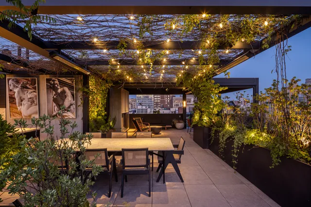 a view of a chairs and table in a patio