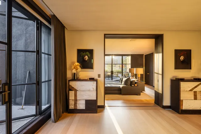 a view of a living room and a balcony