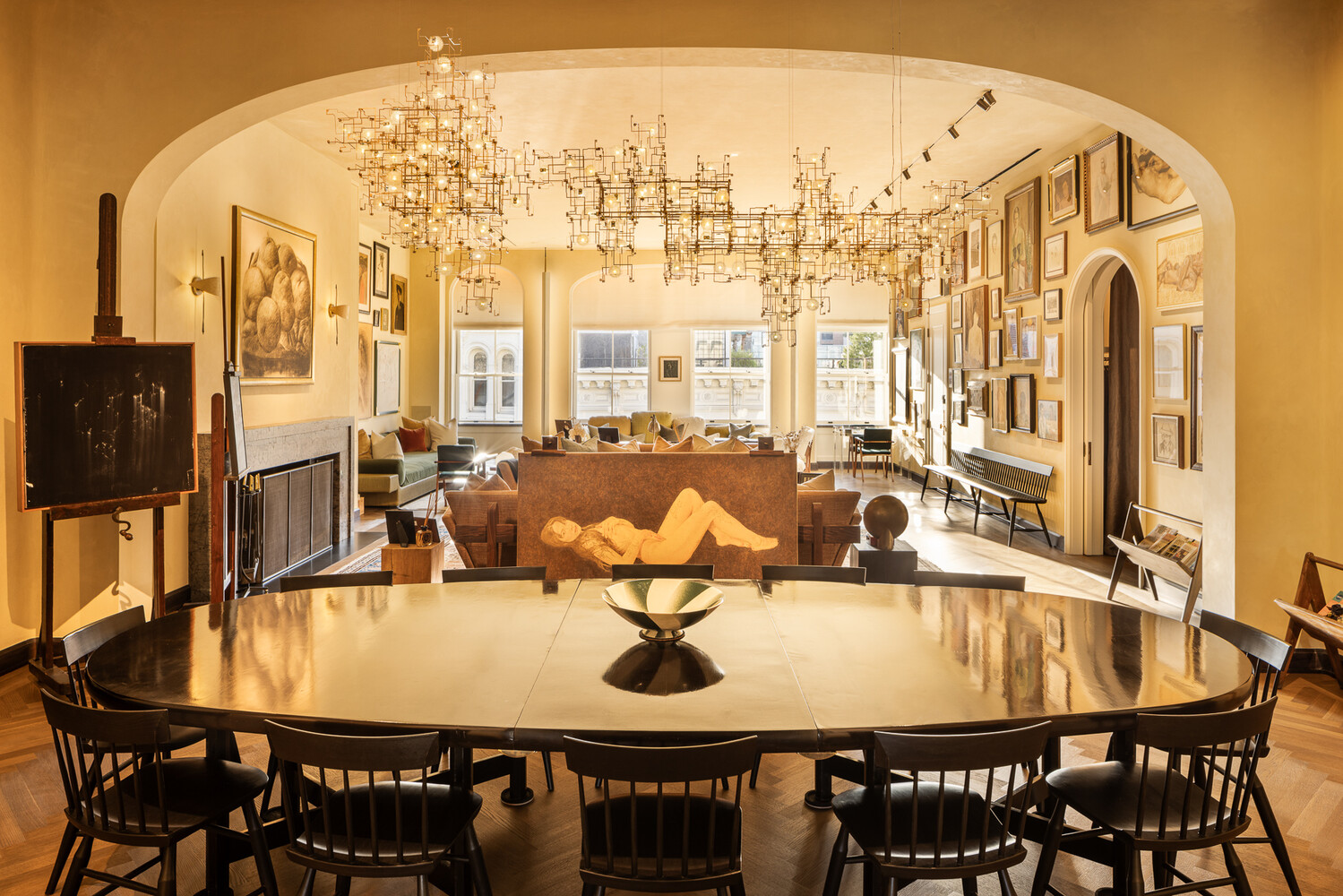a view of a dining room with furniture and chandelier