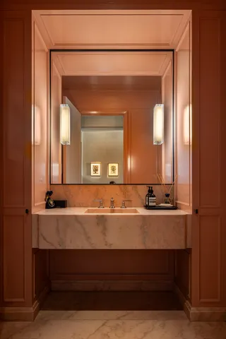 a bathroom with a sink vanity and a mirror