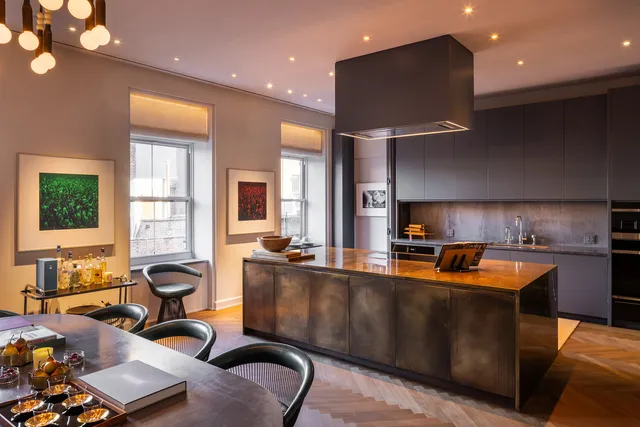 a large kitchen with stainless steel appliances lots of counter top space