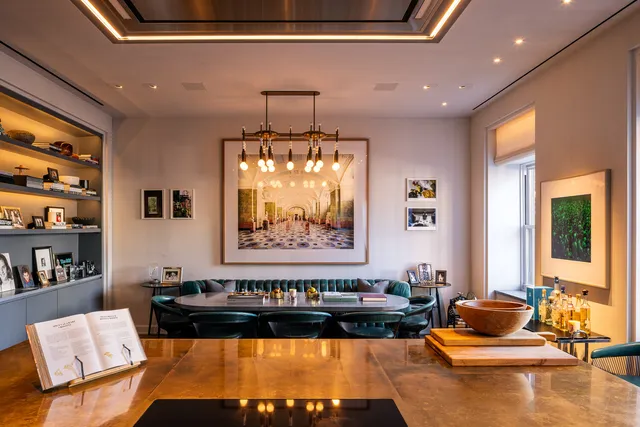 a living room with furniture and floor to ceiling window