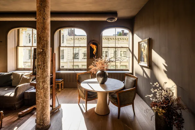 a dining room with furniture and window