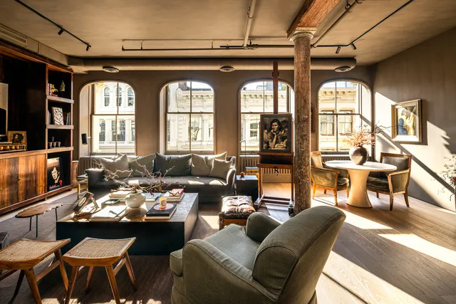 a living room with furniture fireplace and flat screen tv