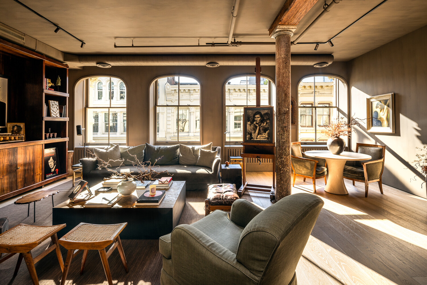 20 Greene Street, Unit PH Manhattan, NY 10013 - Photo 34 of 38 a living room with furniture fireplace and flat screen tv