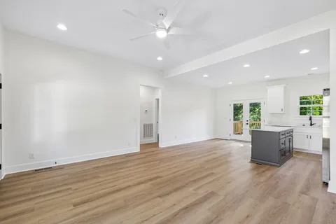 a kitchen with stainless steel appliances a stove a sink and a refrigerator