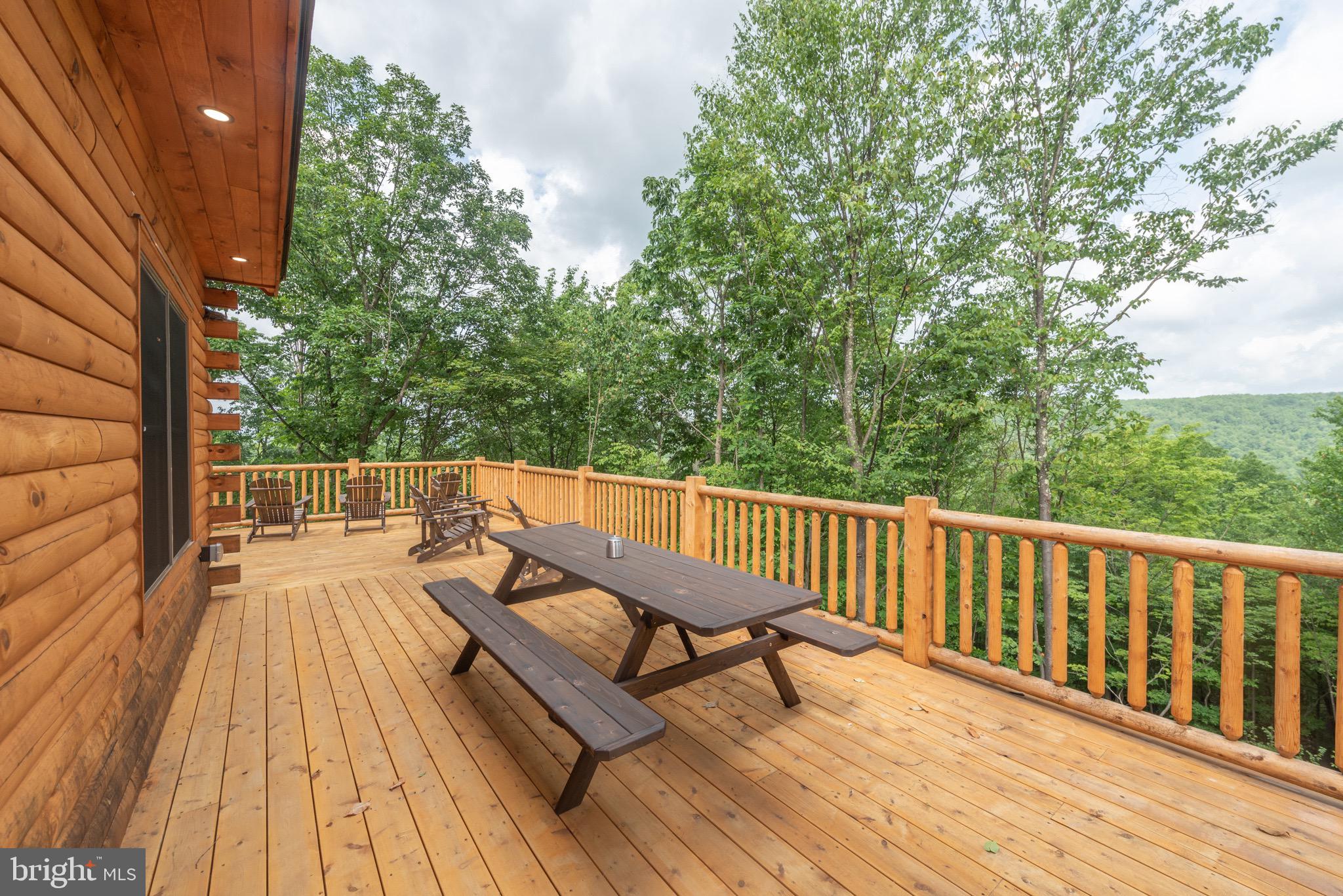 828 North Camp Road McHenry, MD 21541 - Photo 15 of 59 a view of balcony with wooden floor and outdoor seating