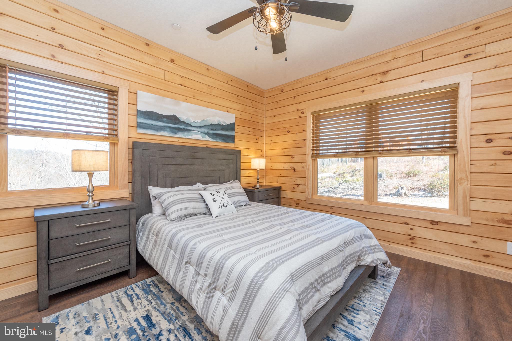828 North Camp Road McHenry, MD 21541 - Photo 21 of 59 a bedroom with a large bed and a window