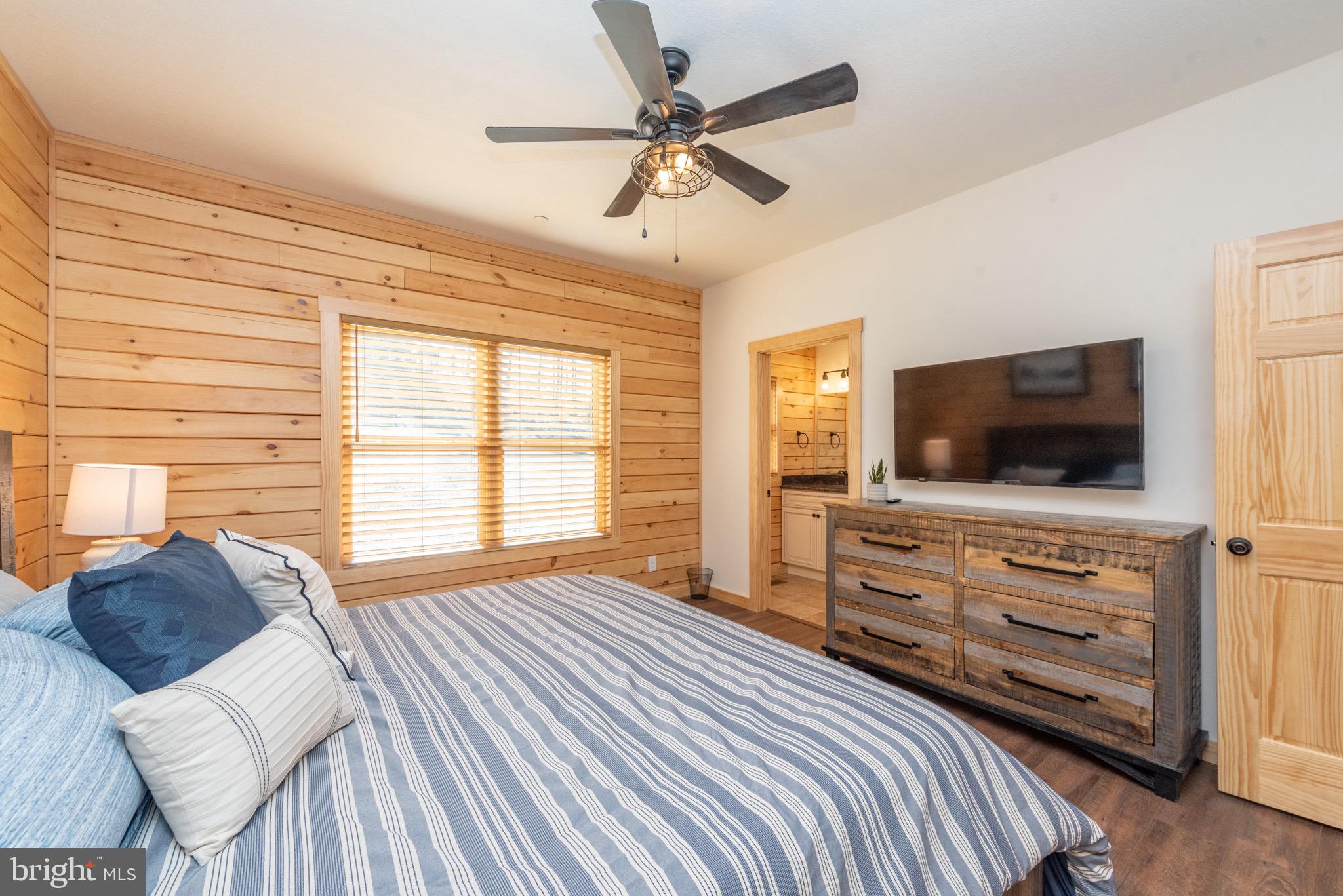 828 North Camp Road McHenry, MD 21541 - Photo 25 of 59 a bedroom with furniture and a flat screen tv