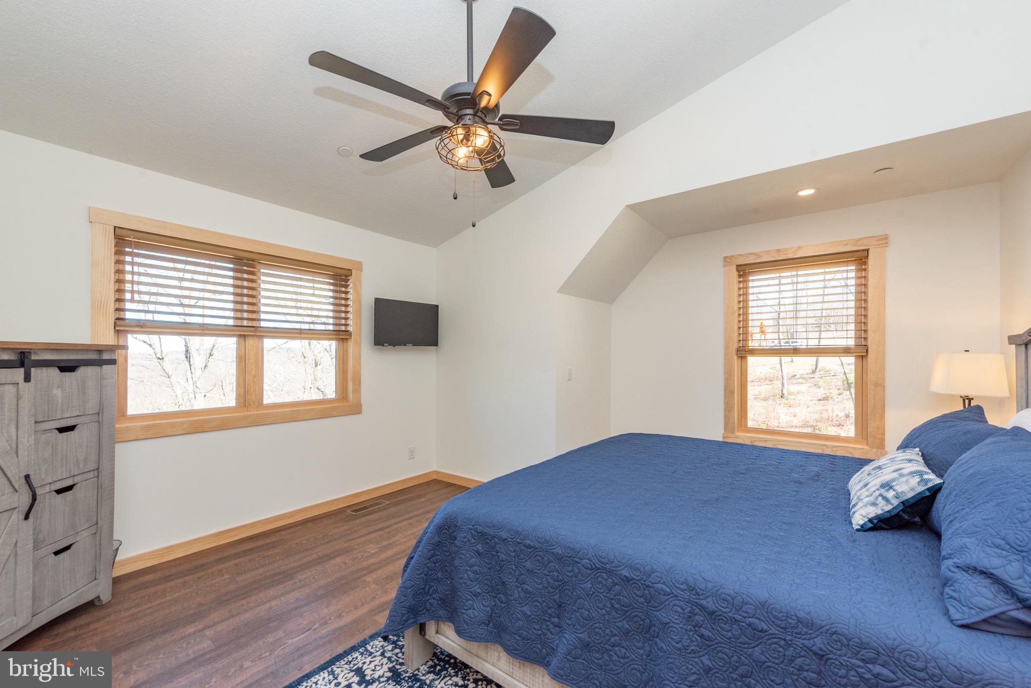 828 North Camp Road McHenry, MD 21541 - Photo 29 of 59 a bedroom with a bed and window