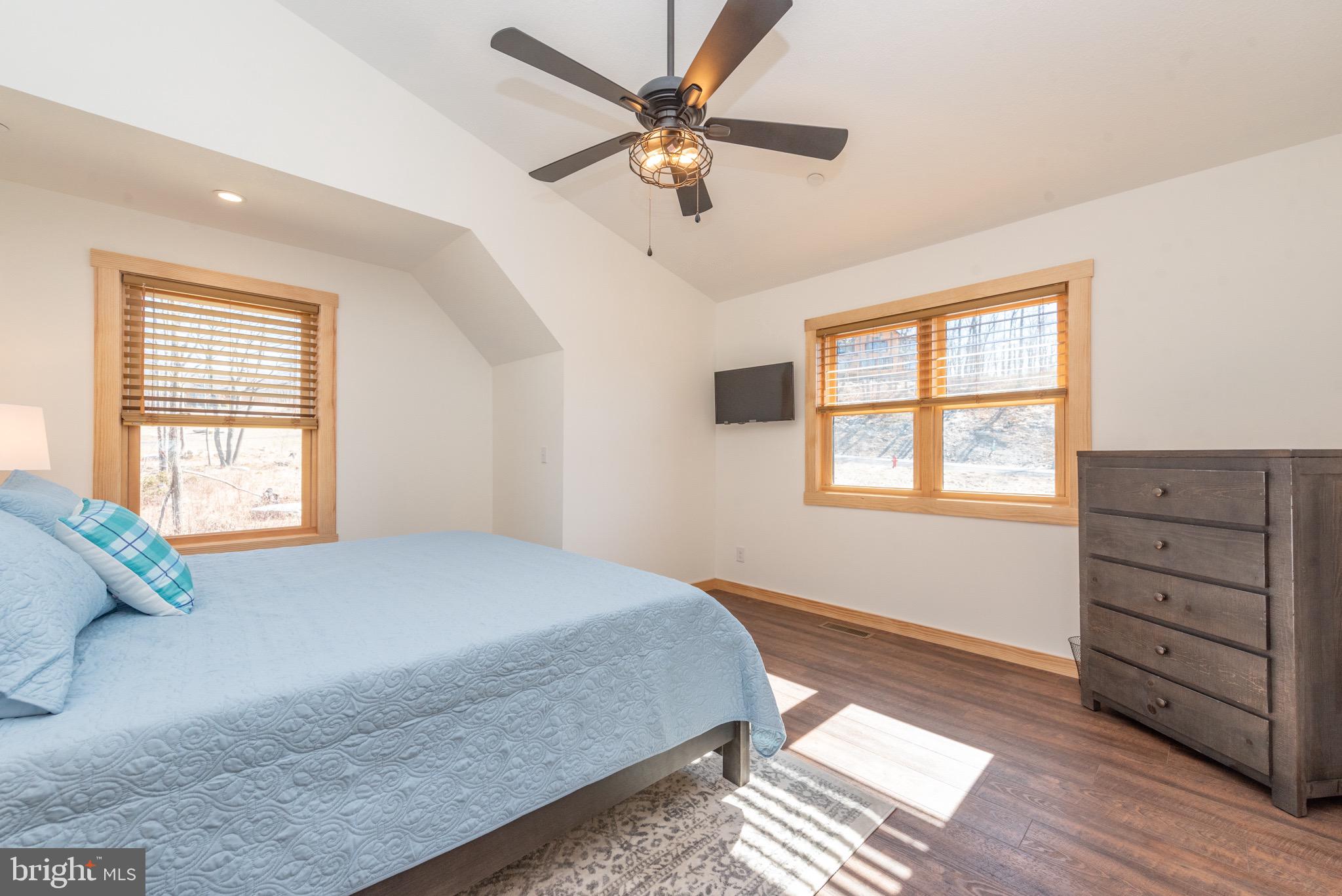 828 North Camp Road McHenry, MD 21541 - Photo 33 of 59 a bedroom with a bed and a window