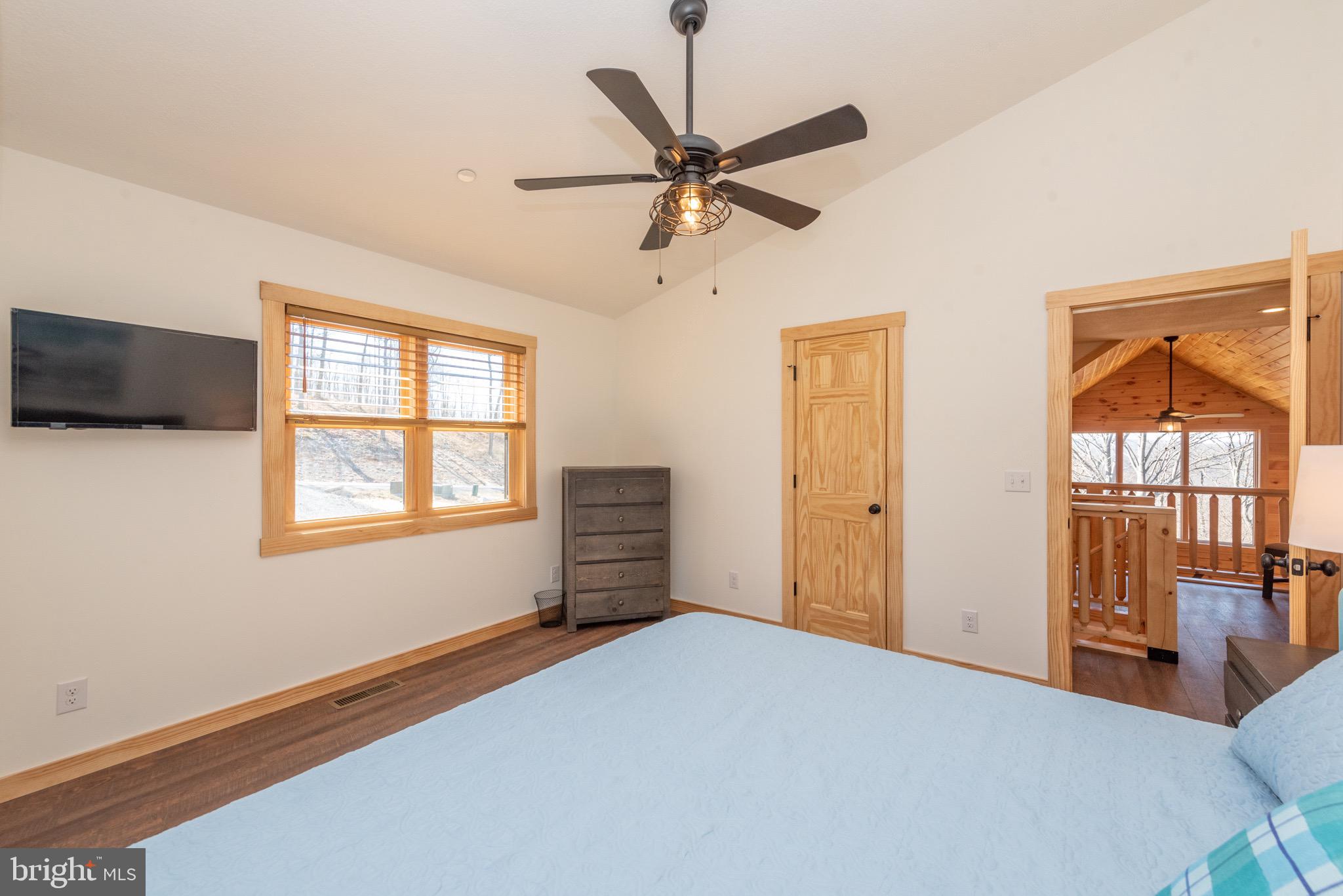 828 North Camp Road McHenry, MD 21541 - Photo 36 of 59 a bedroom with a bed and a window