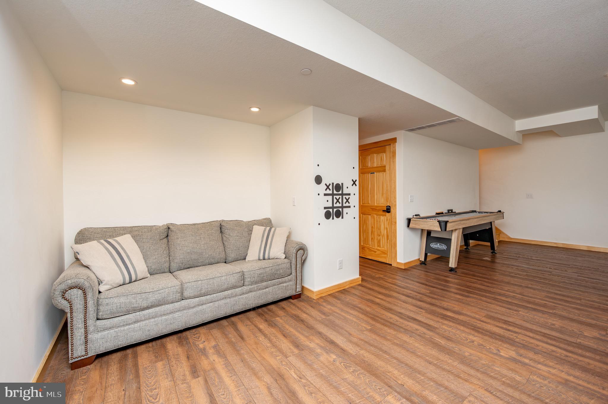 828 North Camp Road McHenry, MD 21541 - Photo 39 of 59 a living room with furniture and a wooden floor
