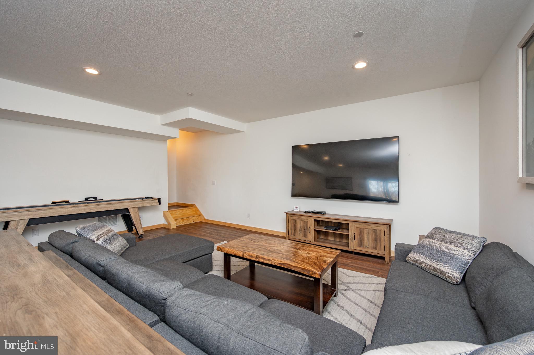 828 North Camp Road McHenry, MD 21541 - Photo 41 of 59 a living room with furniture and a flat screen tv