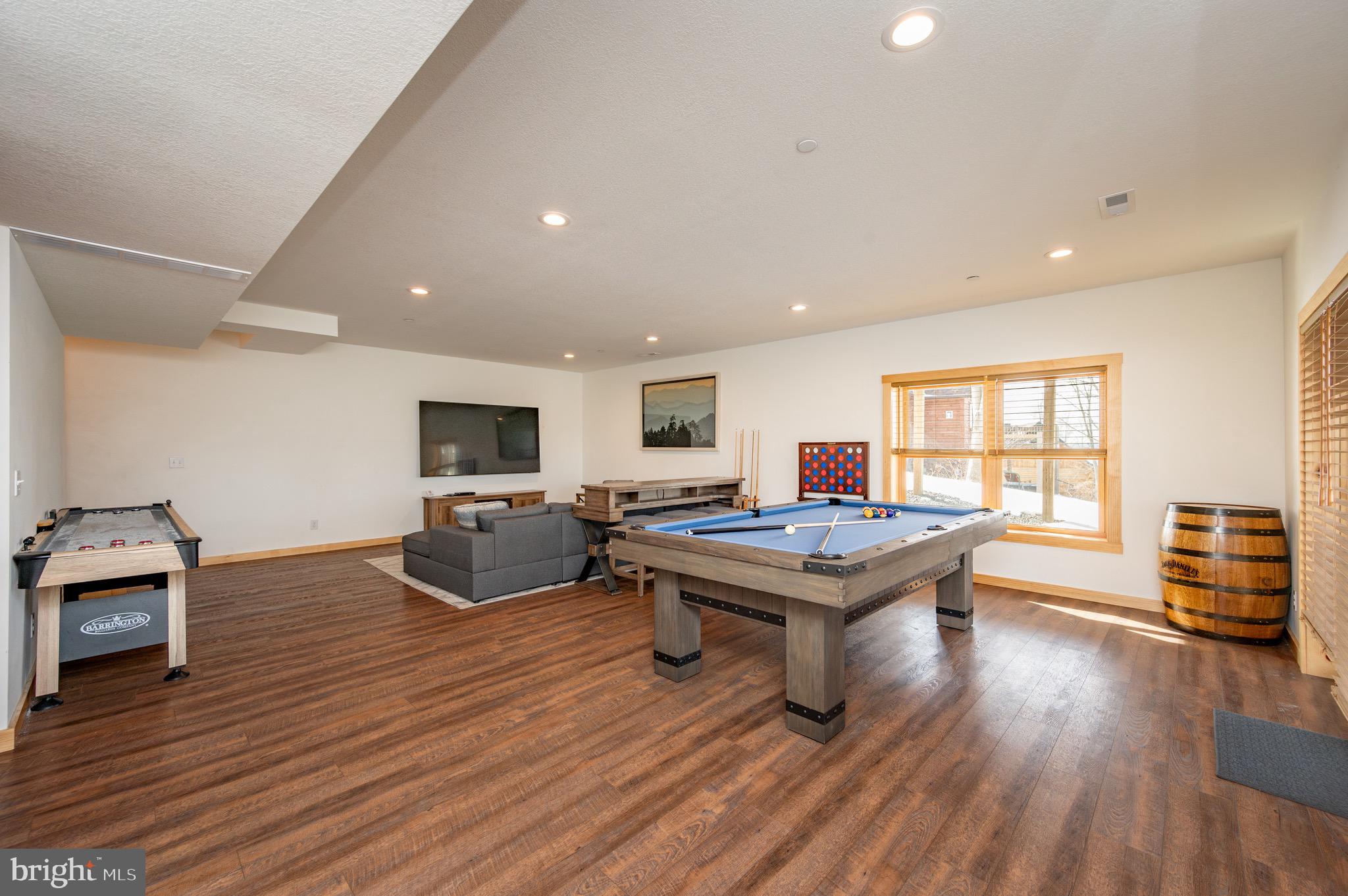 828 North Camp Road McHenry, MD 21541 - Photo 44 of 59 a living room with furniture a table and wooden floor