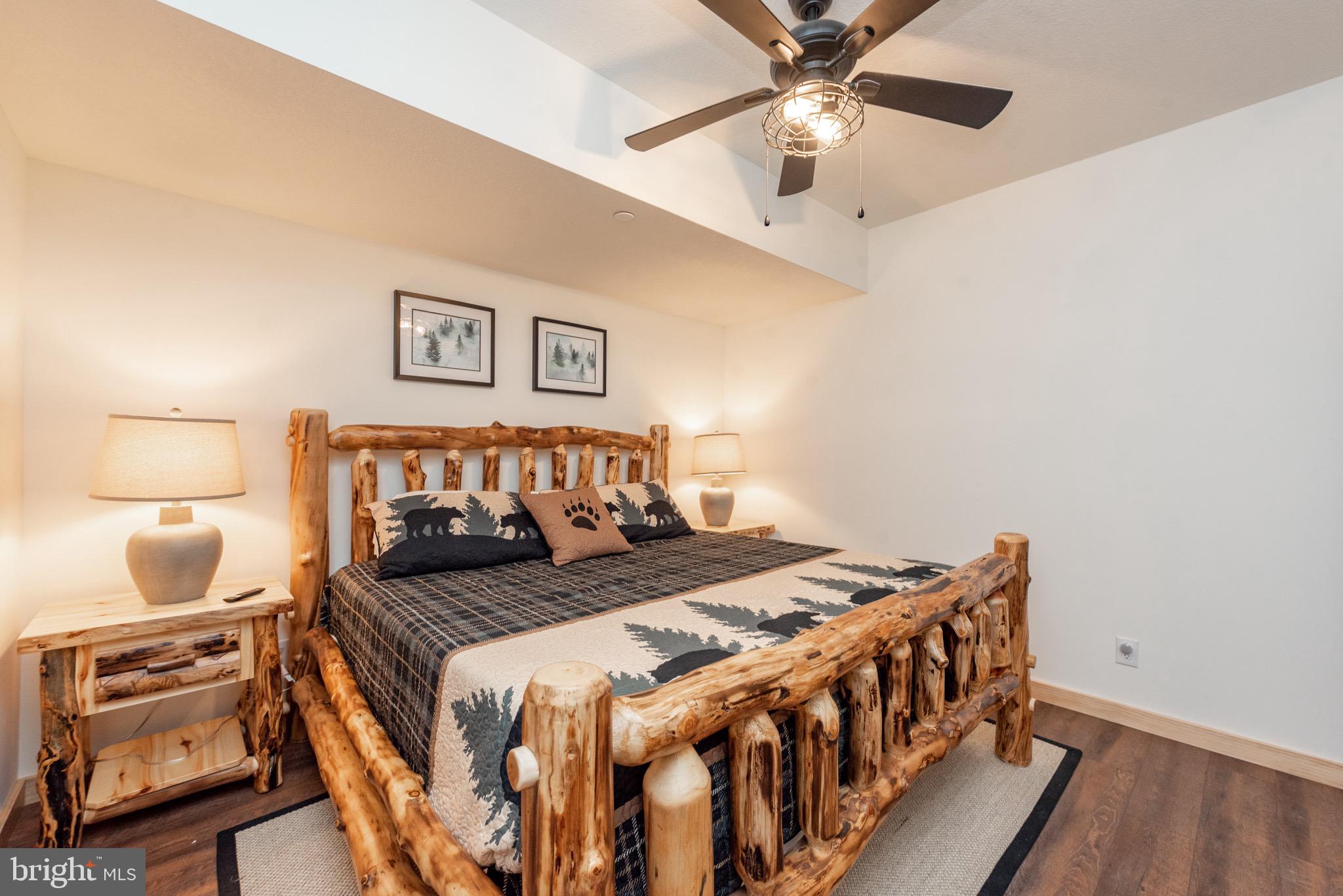 828 North Camp Road McHenry, MD 21541 - Photo 48 of 59 a bedroom with a bed and a lamp