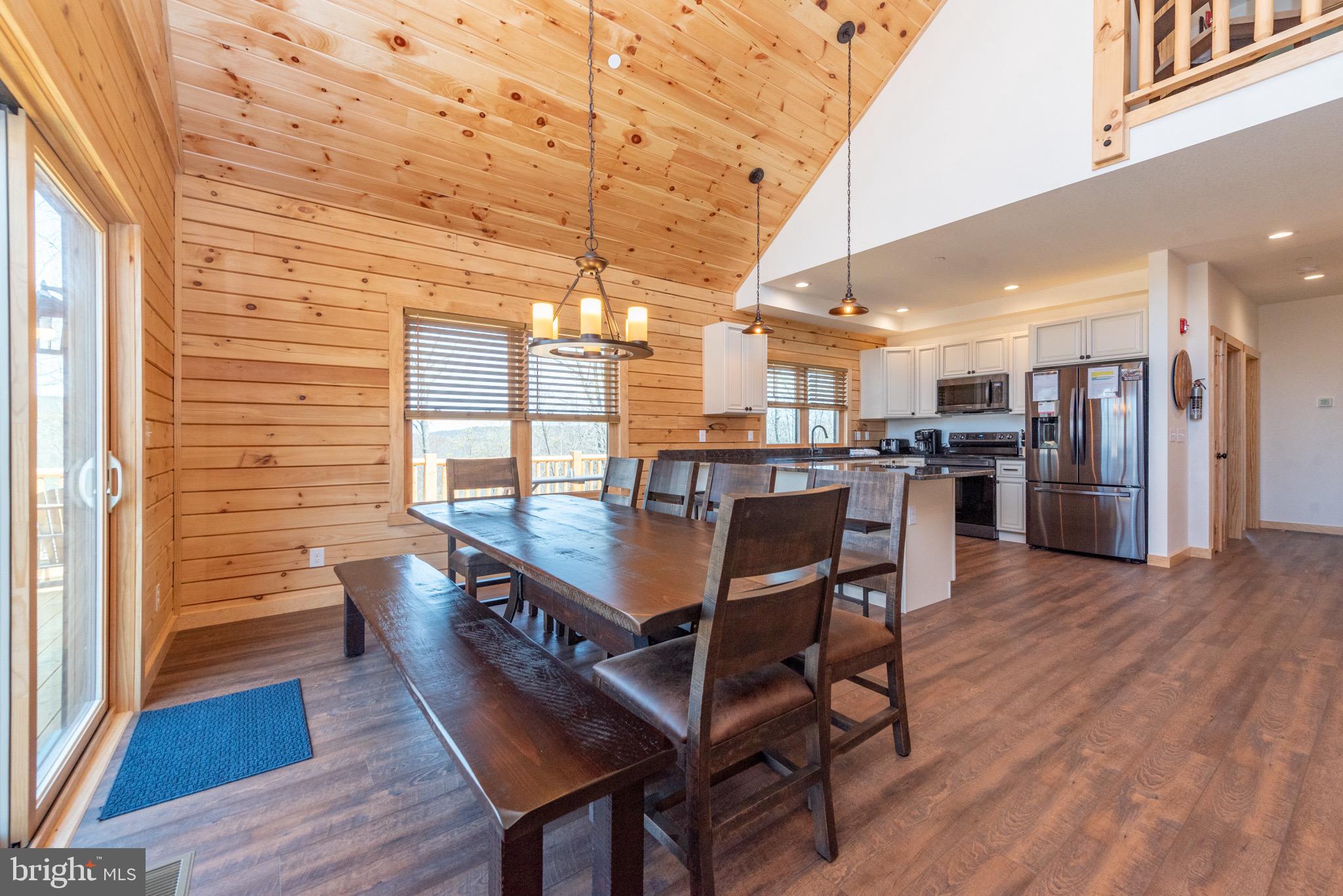828 North Camp Road McHenry, MD 21541 - Photo 7 of 59 a dining room with furniture and wooden floor