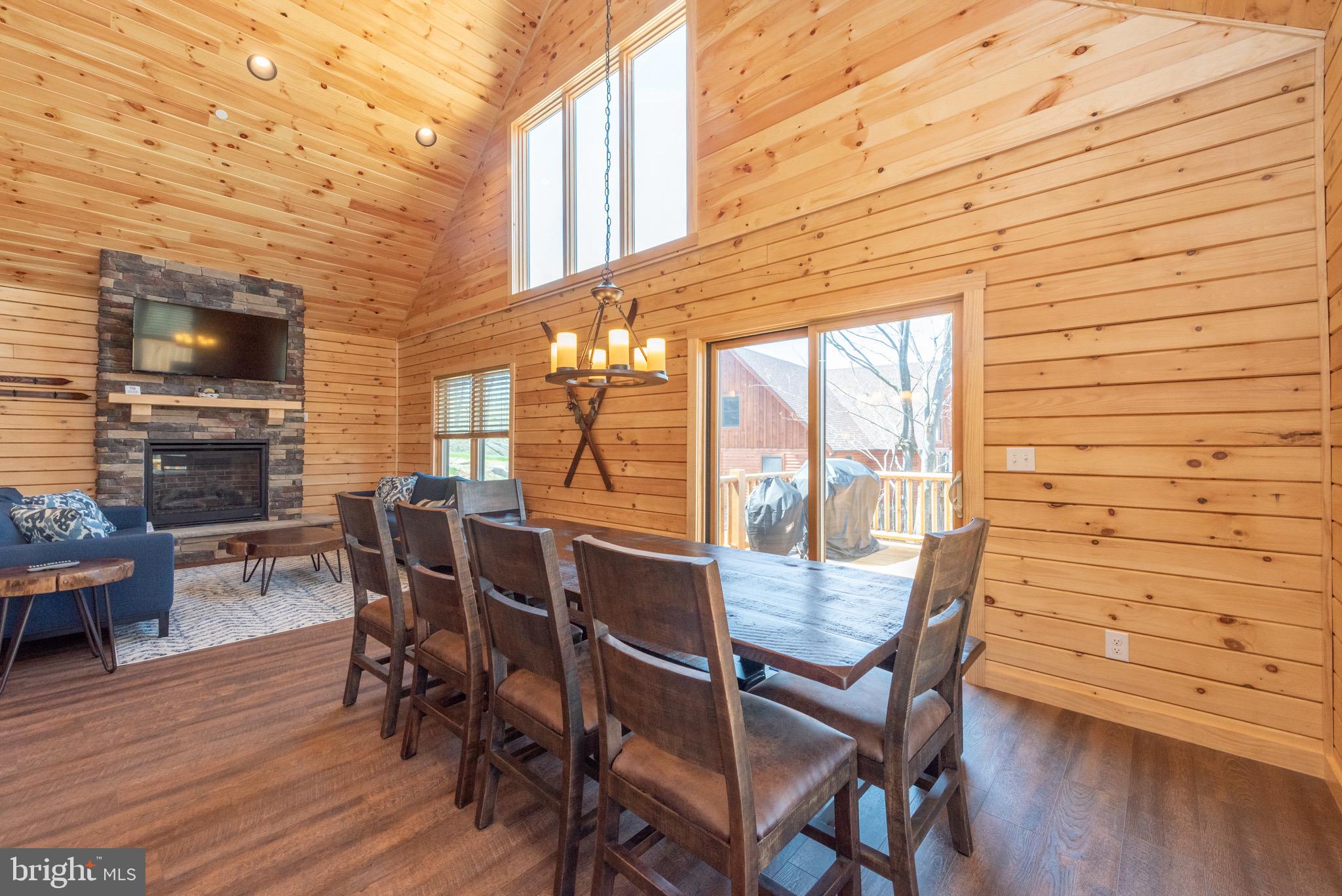 828 North Camp Road McHenry, MD 21541 - Photo 9 of 59 a view of a dining room with furniture and wooden floor