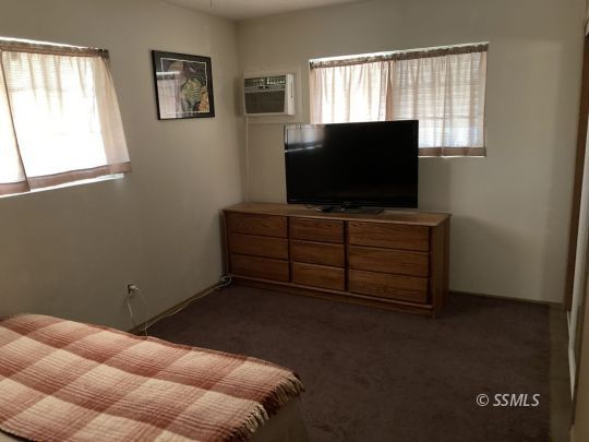 77 Adams Road Wofford Heights, CA 93285 - Photo 8 of 22 a room with furniture and window