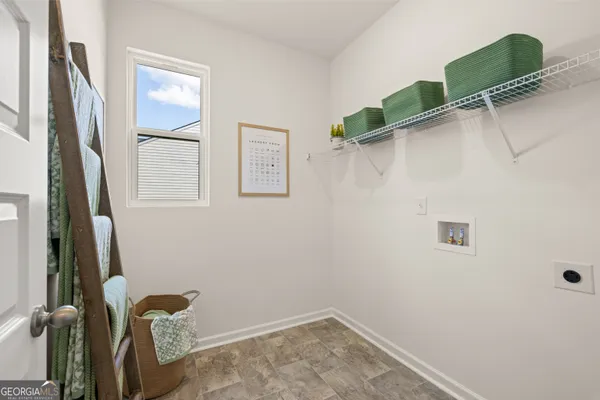 a bedroom with a bed and a night stand