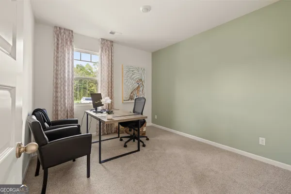 a bathroom with a tub a sink and mirror